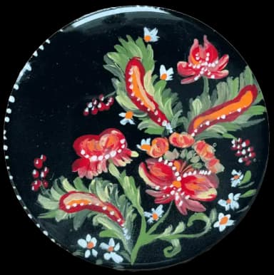 Petrykivka folk art. Red and white flowers with the green leaves on the black background