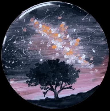 Black tree on the space background with the bright purple and orange stars